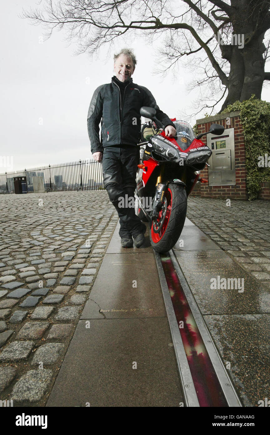 World record breaker Nick Sanders prepares to set off from the Meridian Time Line in Greenwich, London as he embarks on the toughest motorcycle journey known to man. Stock Photo