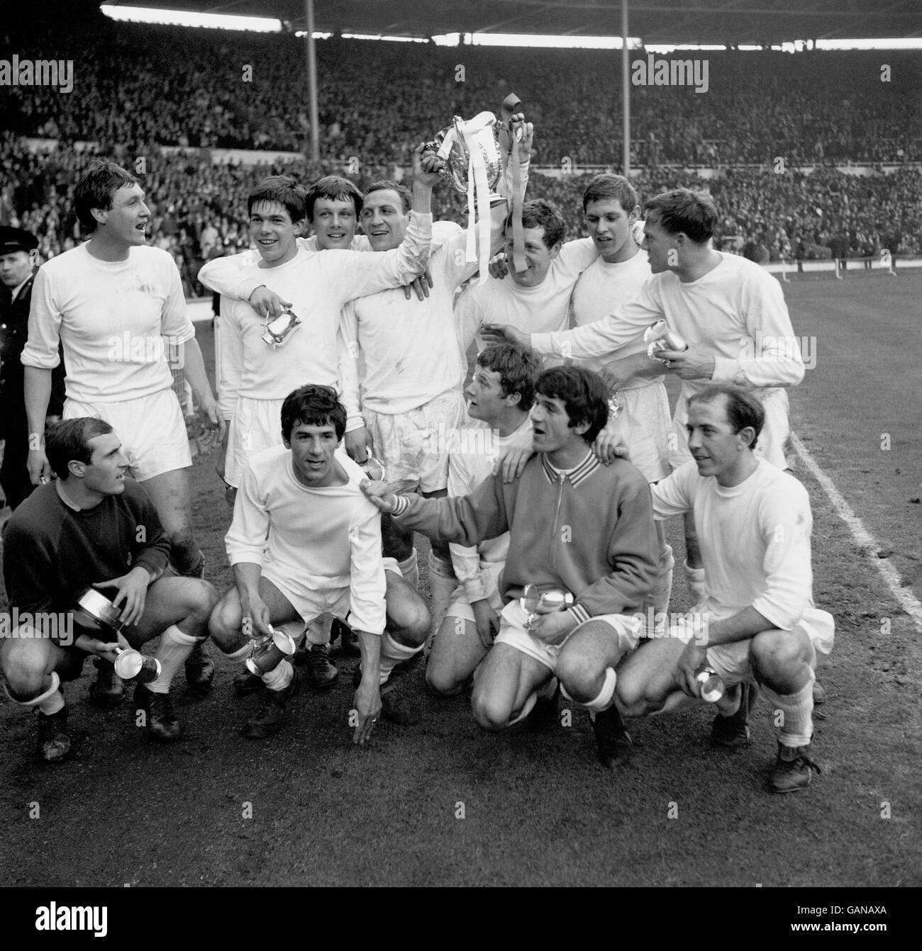 The victorious Queens Park Rangers team celebrate with the Football League Cup after their 3-2 win: (back row, l-r) Mike Keen, Tony Hazell, Ron Hunt, Mark Lazarus, Les Allen, Frank Sibley, Jim Langley; (front row, l-r) Ron Springett, Roger Morgan, Rodney Marsh, sub, Keith Sanderson Stock Photo