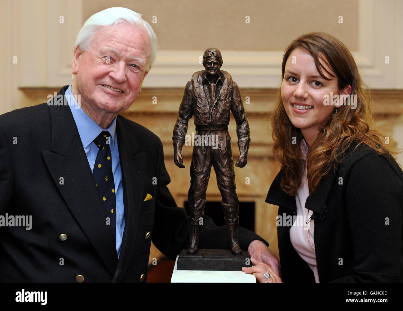 Battle of Britain pilot, Wing Commander Tom Neil and great-great neice Leigh Park at the RAF Club, Piccadilly, London standing next to a model for a statue of Battle of Britain RAF hero, Sir Keith Park, a New Zealander. Stock Photo