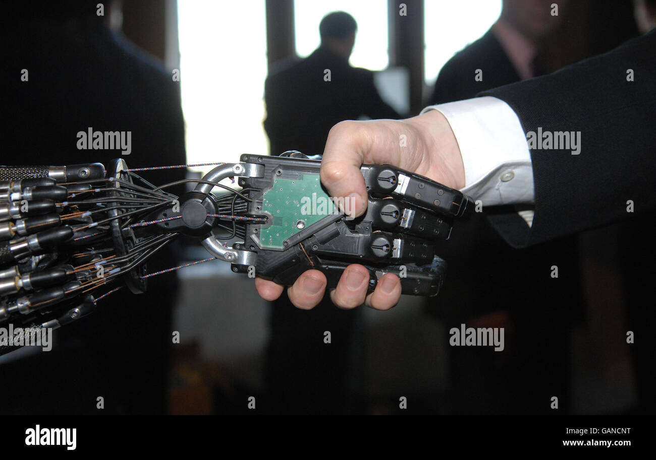 A person shakes hands in the House of Commons, London, with Shadow Robot Company's C5 Dexterous Hand, the only robot hand in the world that is capable of the same movements as the human hand, which is being developed for industrial applications. PRESS ASSOCAITION Photo. Picture date: Tuesday April 22, 2008. The hand was displayed at a special parliamentary reception organised by the Institute of Physics, and the Parliamentary Office of Science and Technology, where the UK's biggest collection of intelligent robots was presented to the government. Photo credit should read: Tim Ireland/PA Stock Photo