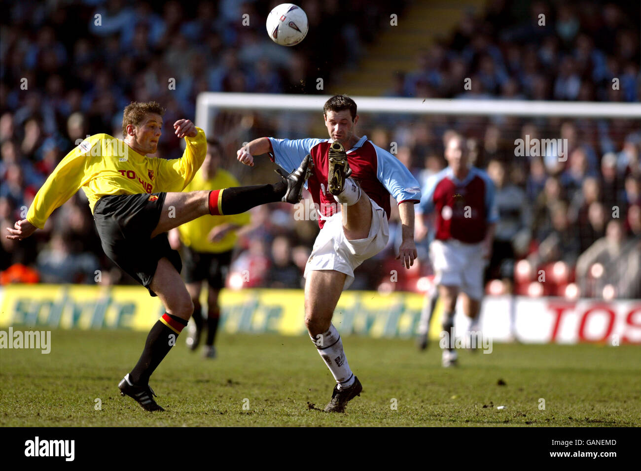 Soccer - AXA FA Cup - Quarter Final - Watford v Burnley. Watford's Neal Ardley and Burnley's Alan Moore battle for the ball Stock Photo