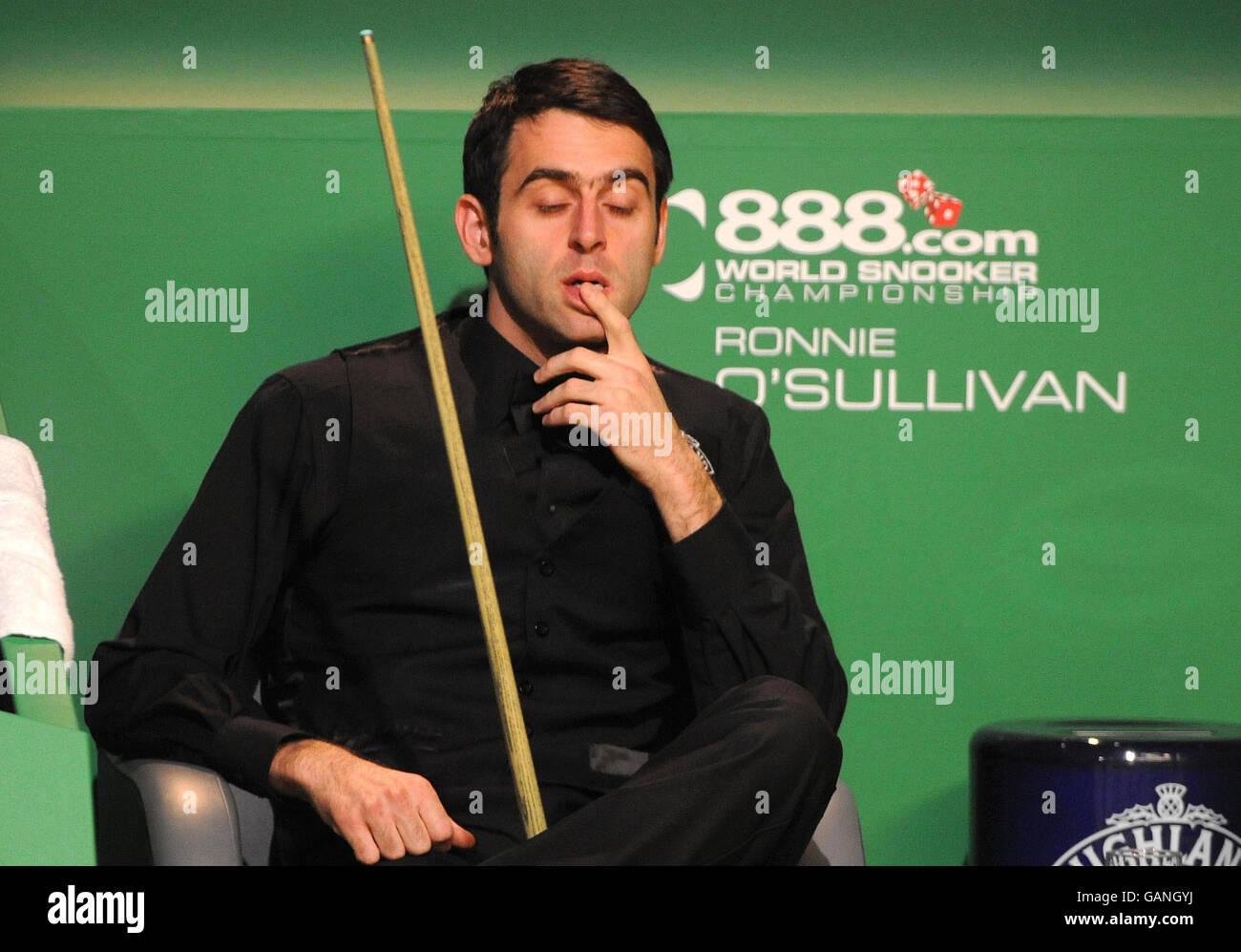 Ronnie OSullivan sits in his chair during his semi final match during the 888 World Snooker Championship at the Crucible Theatre, Sheffield Stock Photo