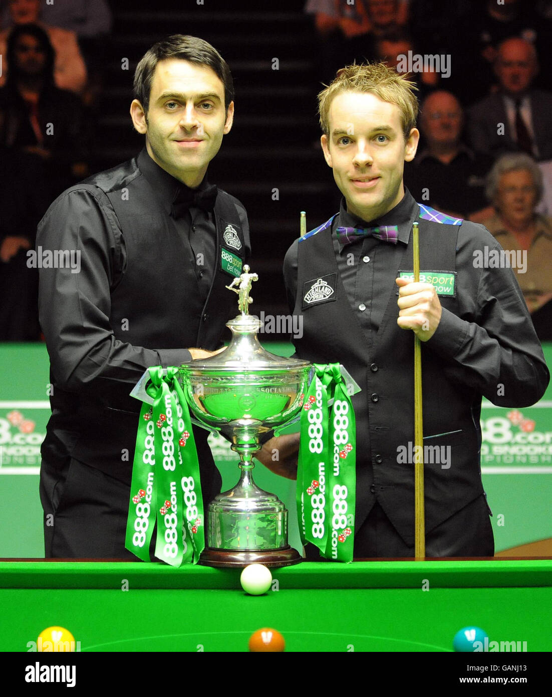 Ronnie O'Sullivan (left) and Ali Carter before the start of the final during the 888.com World Snooker Championship at the Crucible Theatre, Sheffield. Stock Photo