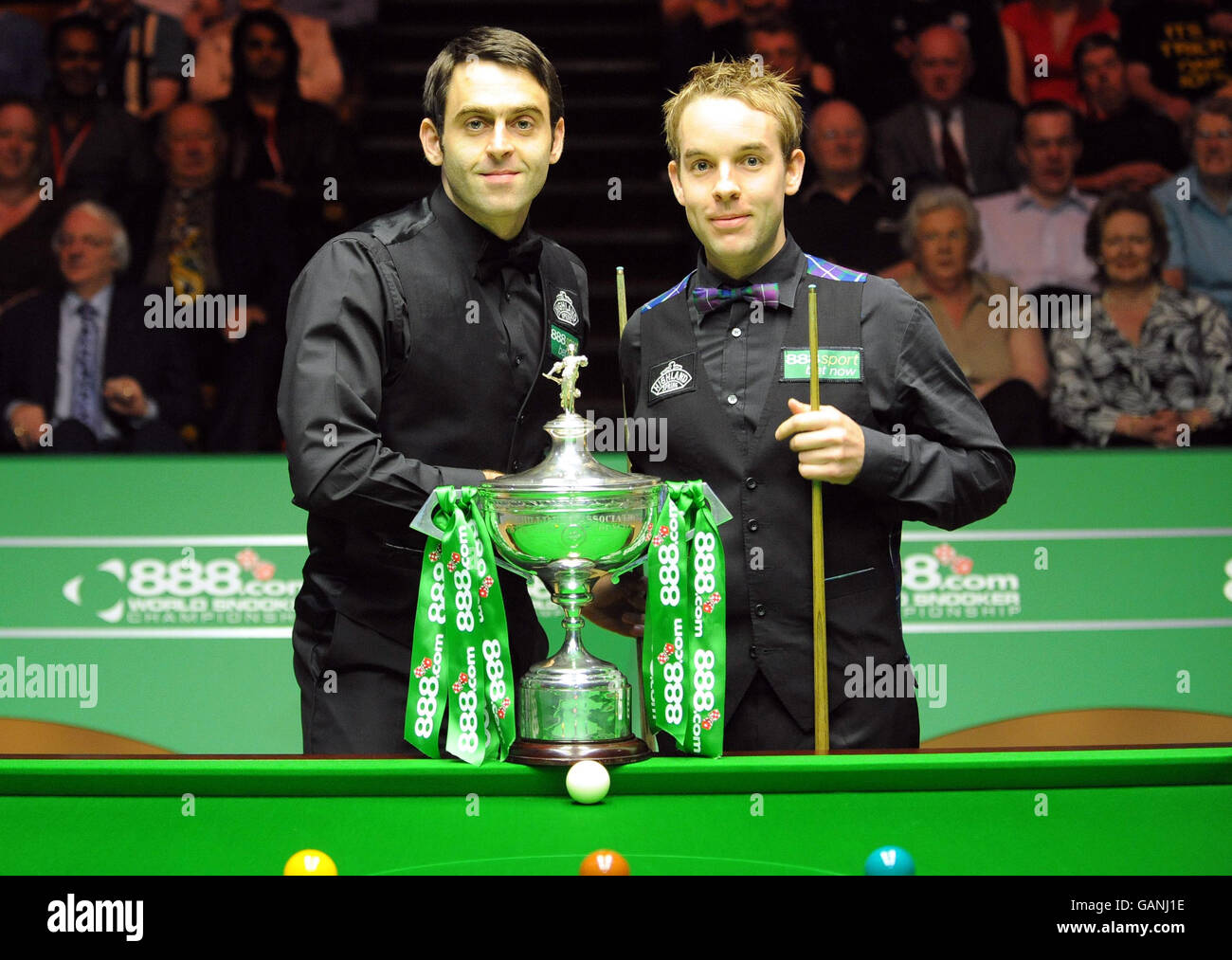 Ronnie O'Sullivan and Ali Carter before the start of the final of the 888.com World Snooker Championship at the Crucible Theatre, Sheffield. Stock Photo