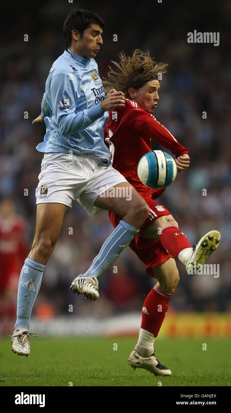 Soccer - Barclays Premier League - Liverpool v Manchester City - Anfield. Liverpool's Fernando Torres and Manchester City's Vedran Corluka battle for the ball. Stock Photo