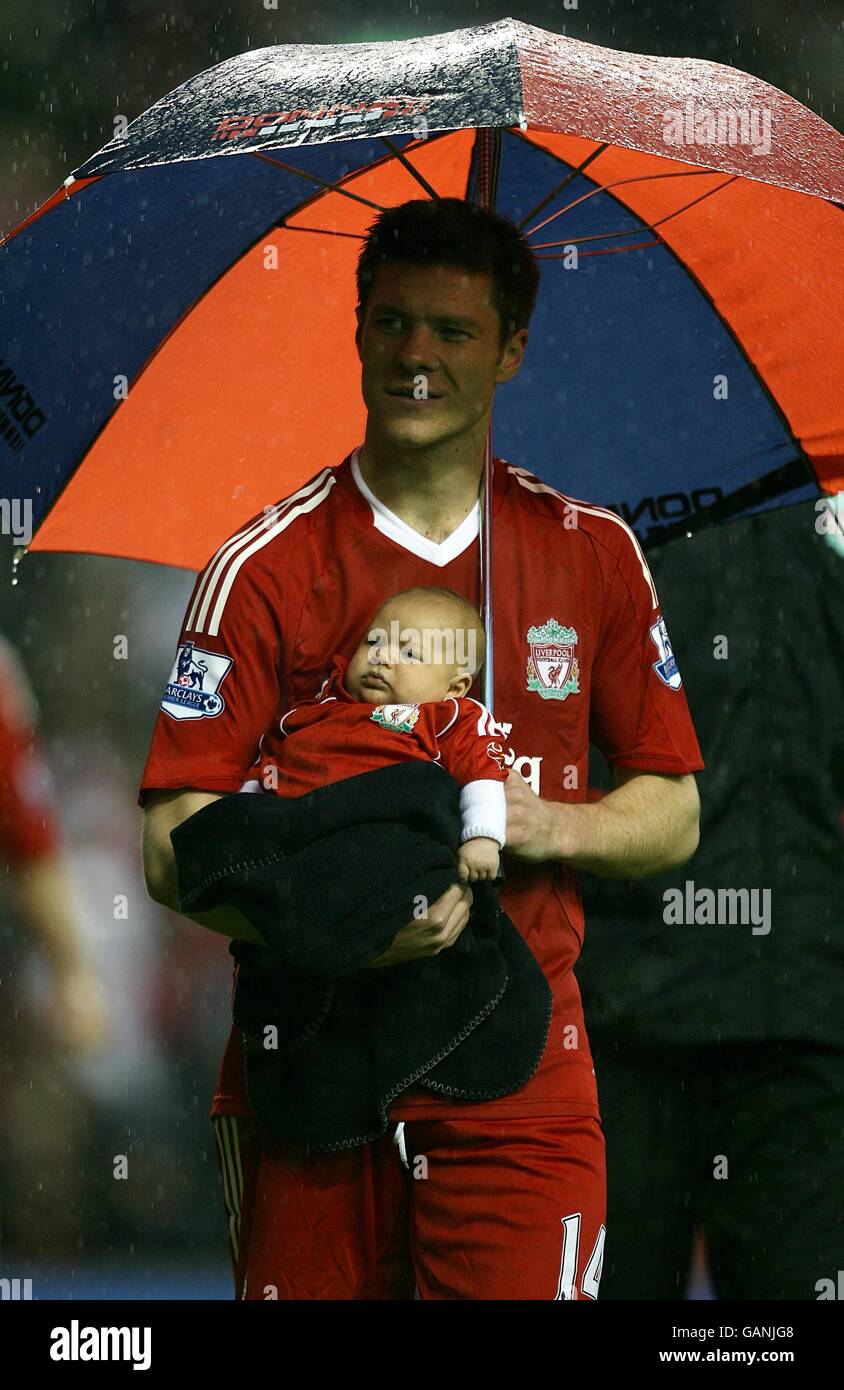 Liverpools xabi alonso his daughter during the lap of honour hires