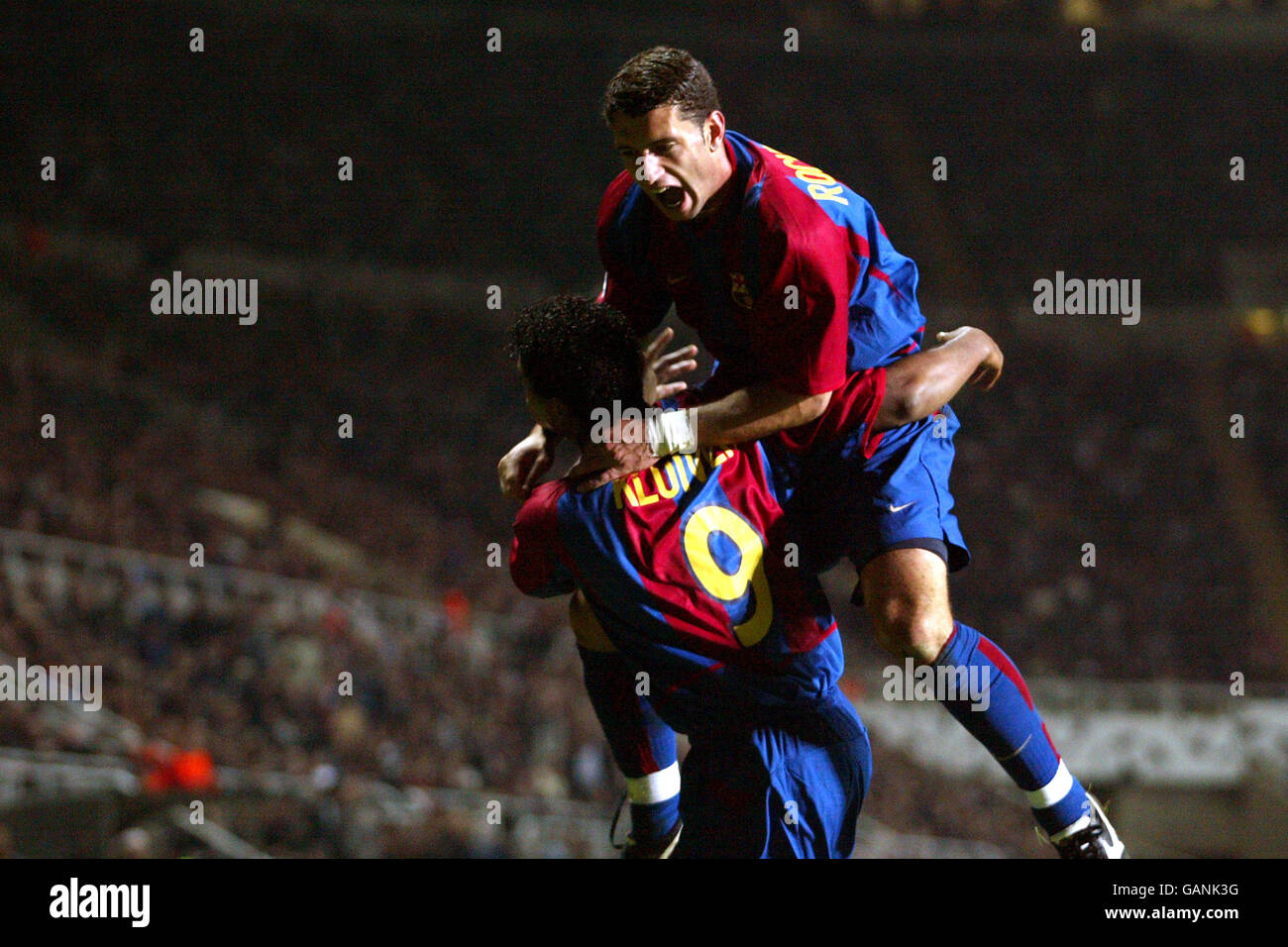 Soccer - UEFA Champions League - Group A - Newcastle United v Barcelona. Barcelona's Patrick Kluivert celebrates scoring the opening goal against Newcastle United with teammate Fabio Rochemback (top) Stock Photo