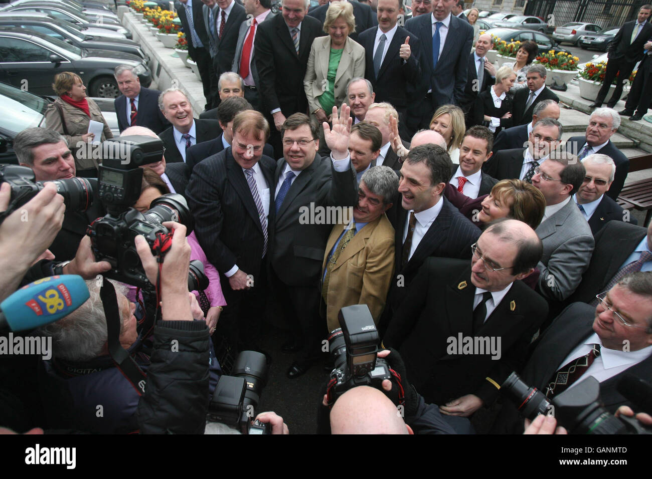 Irish Taoiseach-in-waiting Brian Cowen celebrates after he was publicly unveiled as Fianna Fail party leader-designate today outside the Dail parliament in Dublin. Stock Photo