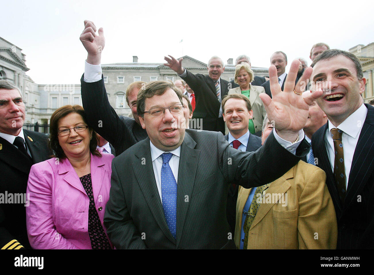 Irish Taoiseach-in-waiting Brian Cowen waves after he was publicly unveiled as Fianna Fail party leader-designate today outside the Dail parliament in Dublin. Stock Photo