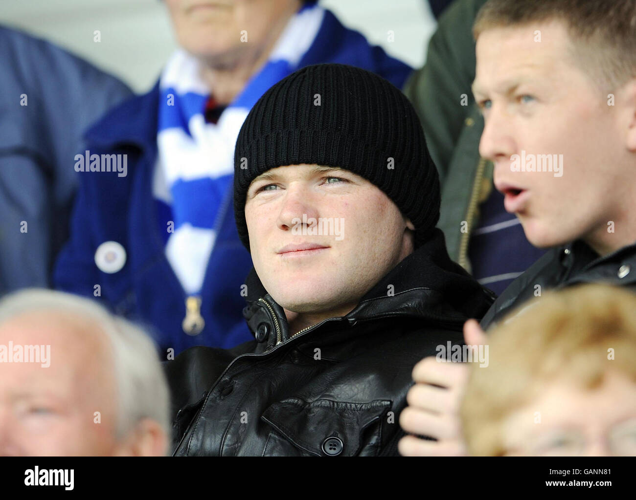 Manchester United's Wayne Rooney takes his place in the stand during the Coca-Cola League Two match at Moss Rose Stadium, Macclesfields. Stock Photo