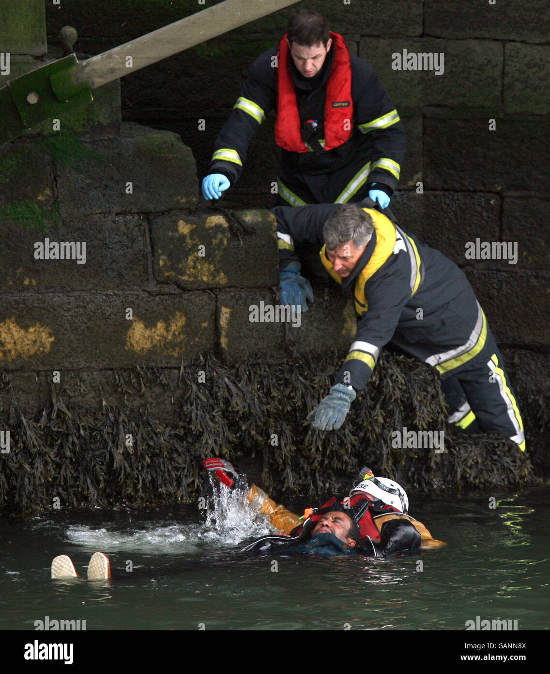 An unknown man is rescued after falling into the river Liffey in Dublin ...