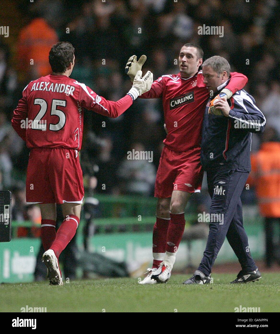 Rangers Goalkeeper Allan McGregor Is Helped Off The Pitch By Assistant rangers-goalkeeper-allan-mcgregor-is-helped-off-the-pitch-by-assistant