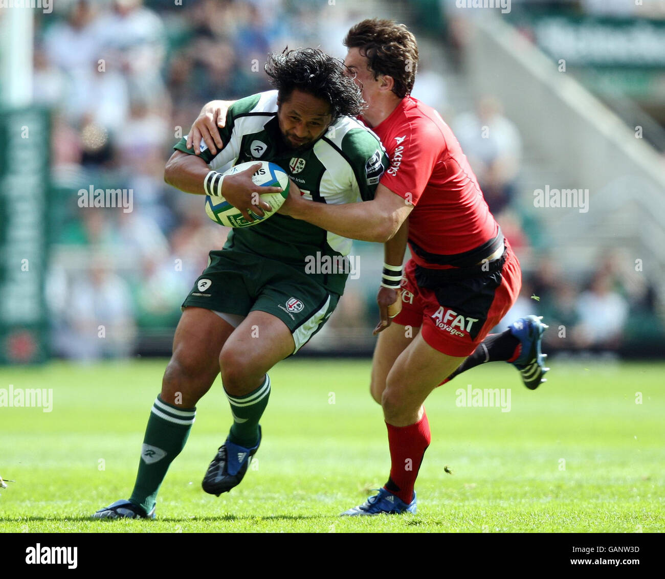 Seilala Mapusua of London Irish is tackled by Yannick Jauzion of Toulouse during the Heineken Cup Semi Final at Twickenham, London. Stock Photo