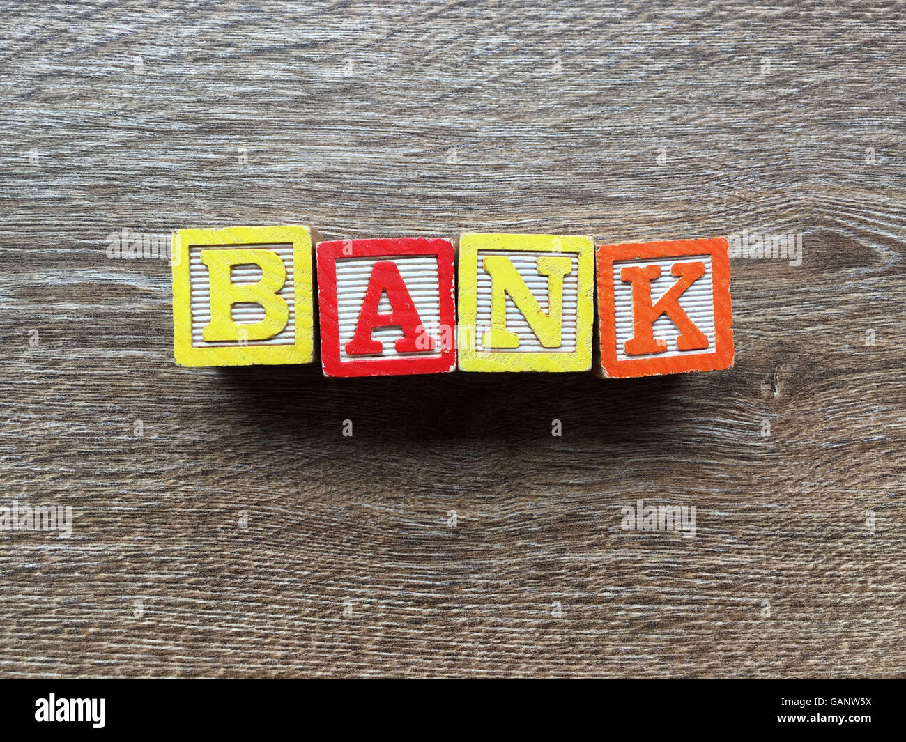 BANK word made with toy wood blocks letters Stock Photo - Alamy