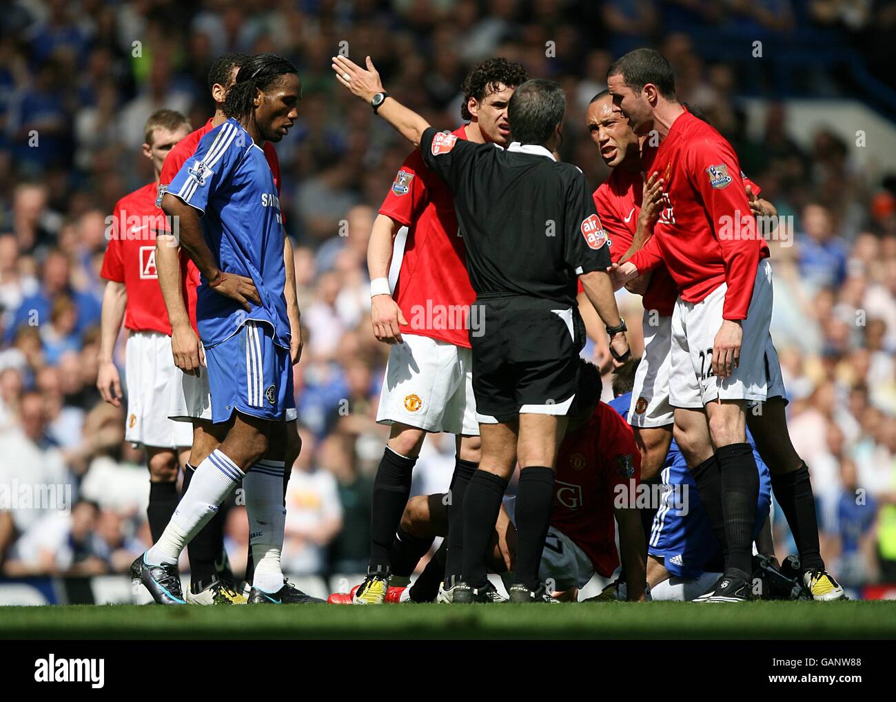 Mikael silvestre john oshea argue with the referee alan wiley hires