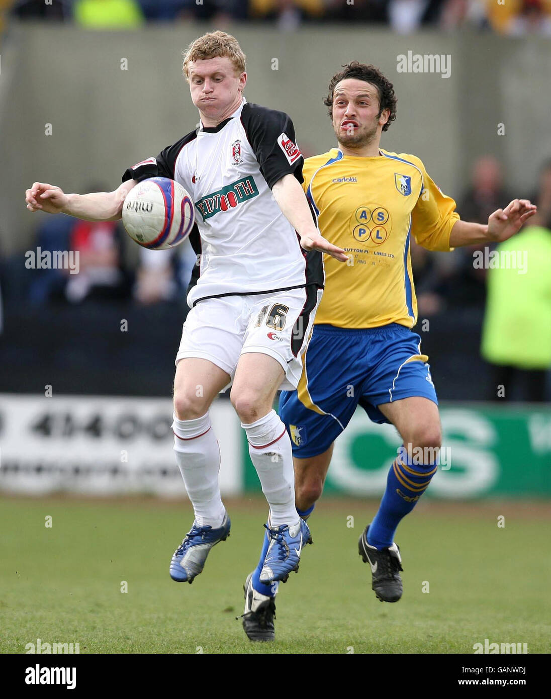 Mansfield Town's Gareth Jelleyman and Rotherham United's Jamie Yates battle for the ball during the Coca-Cola Football League Two match at Field Mill, Mansfield. Stock Photo