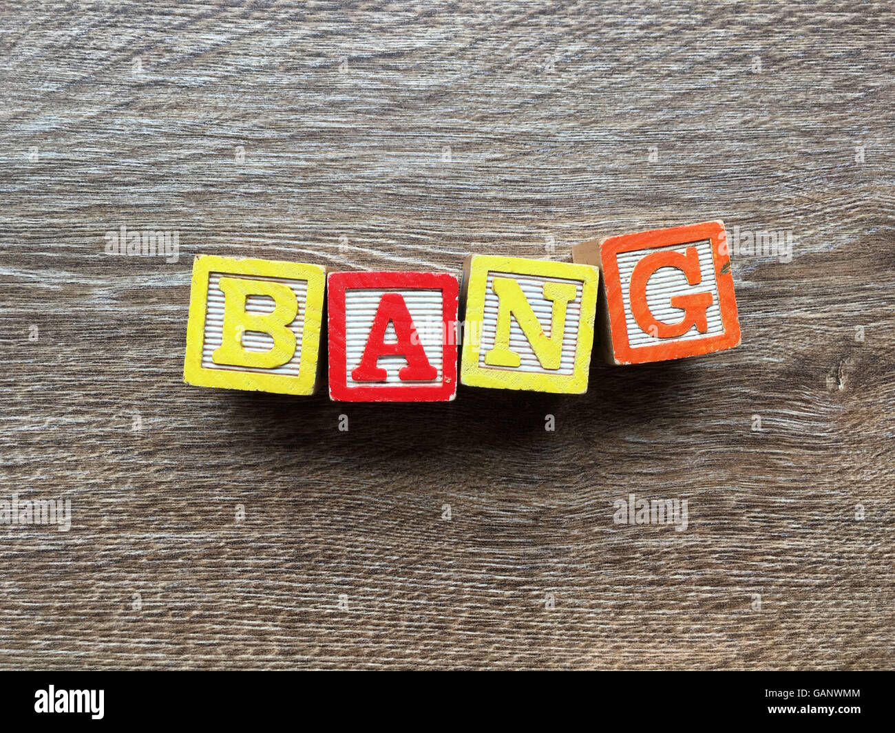 BANG word made with toy wood blocks letters Stock Photo