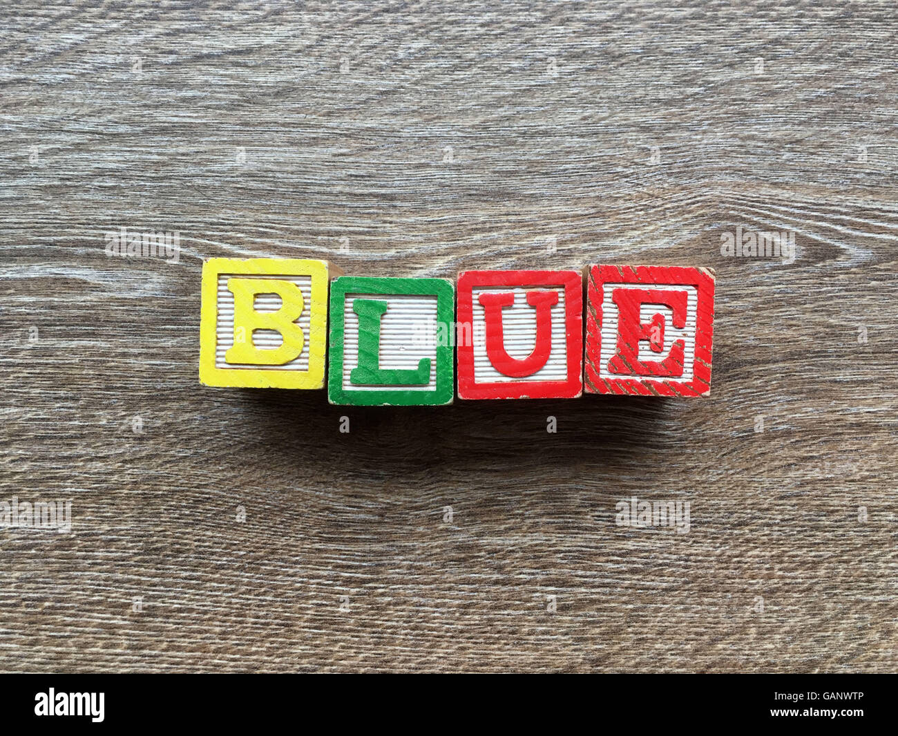 BLUE word made with toy wood blocks letters Stock Photo