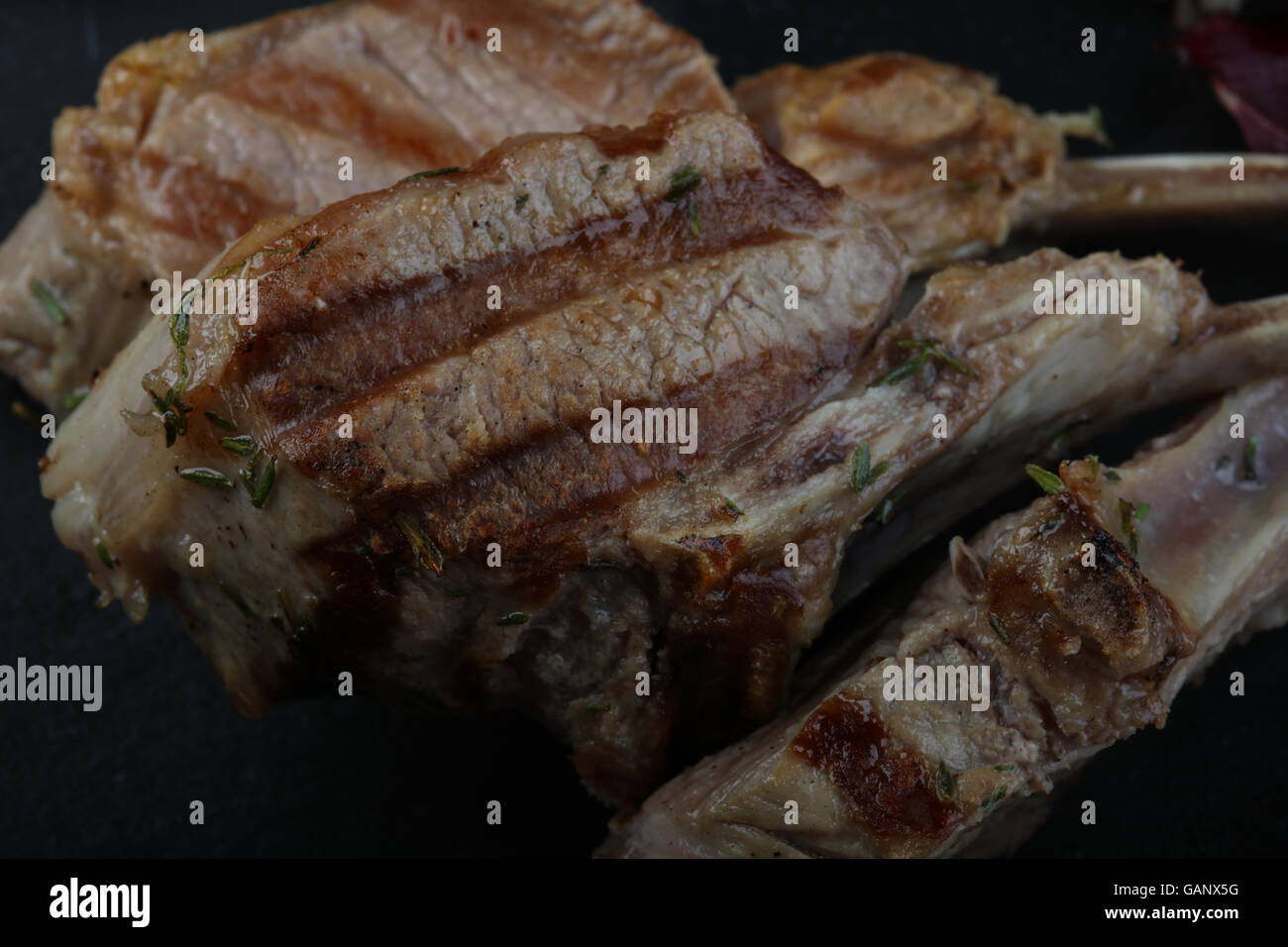 Lamb Frenched Rack grilled rib bone Stock Photo - Alamy