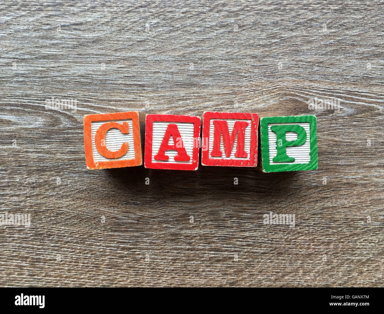CAMP word made with toy wood blocks letters Stock Photo Alamy