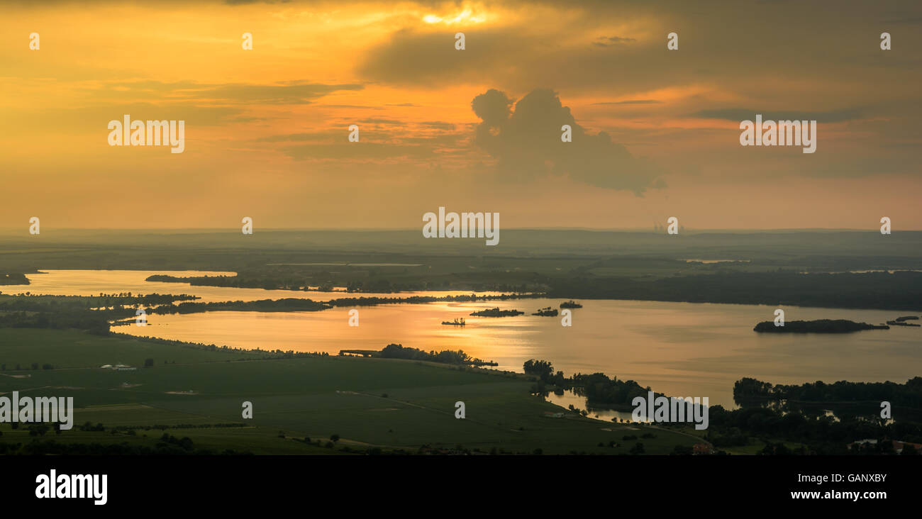 Gold sunset reflection on lake landscape photography Stock Photo - Alamy