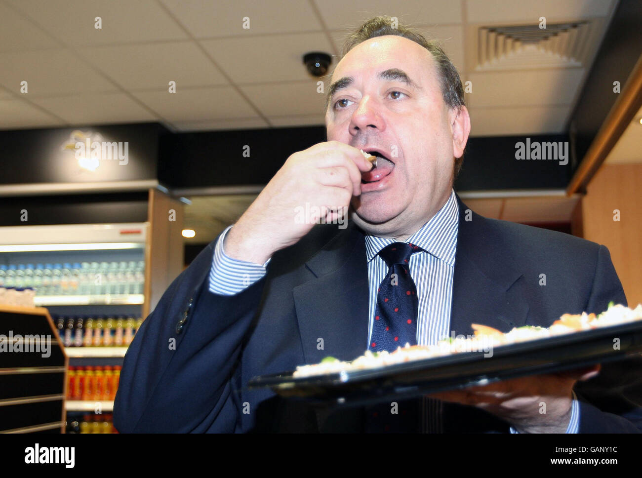Scottish First Minister Alex Salmond enjoys the food on offer in the