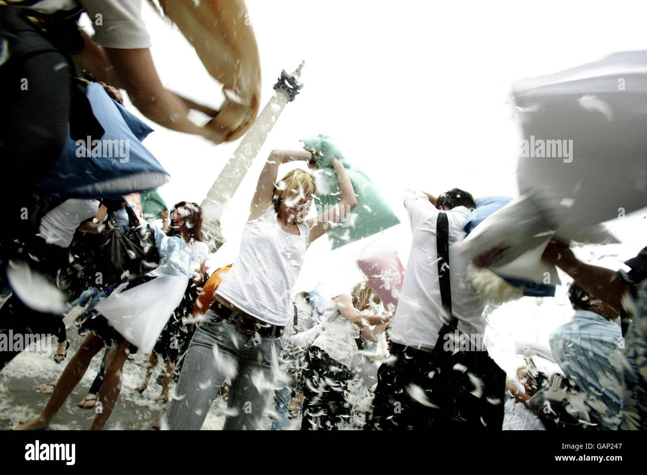 A flash mob-style pillow fight in Trafalgar Square, London to celebrate Andrex's National Softie week. Stock Photo