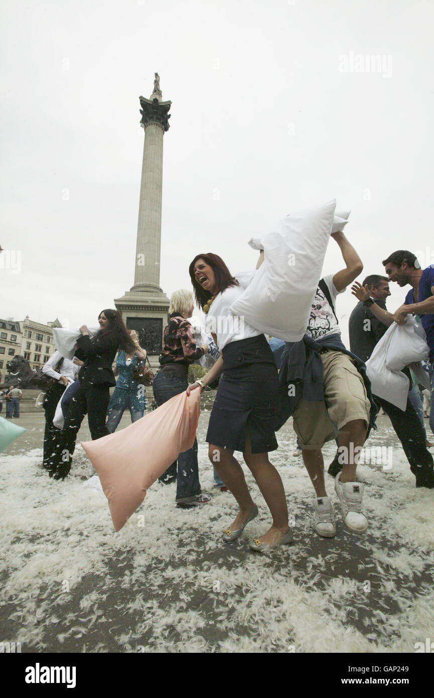 A flash mob-style pillow fight in Trafalgar Square, London to celebrate Andrex's National Softie week. Stock Photo