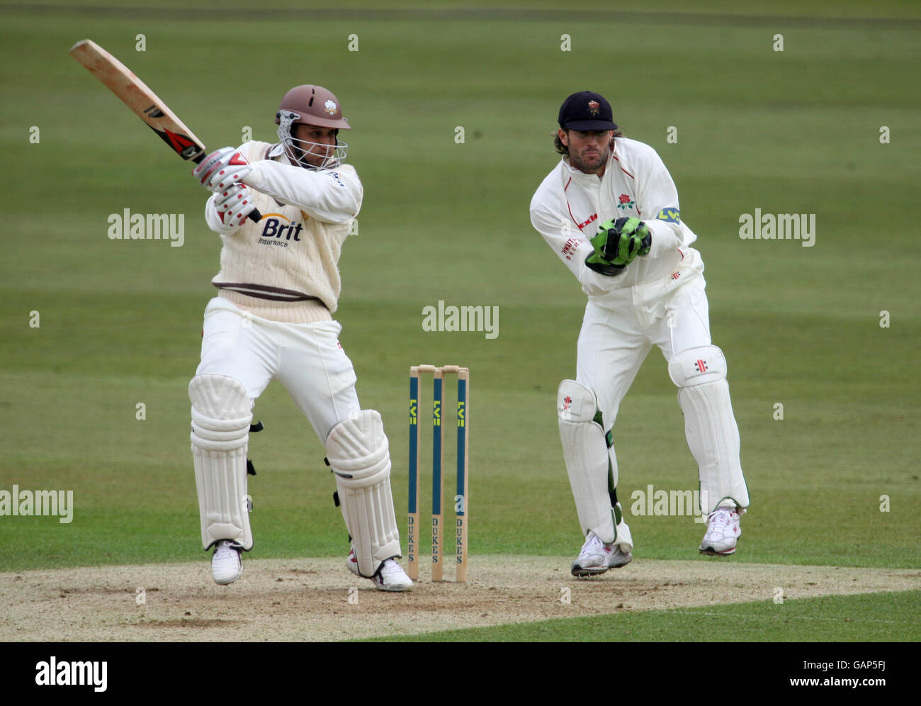 Cricket - Liverpool Victoria County Championship - Division One - Surrey v Lancashire - Day One - The Brit Oval. Surrey's Mark Butcher hits four runs past Lancashire's wicketkeeper Luke Sutton Stock Photo
