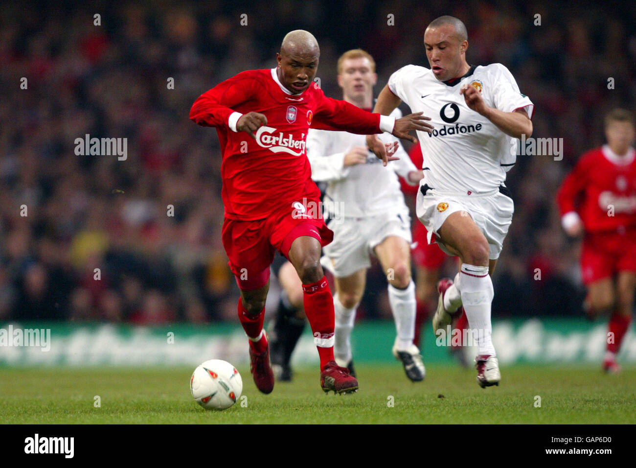 Soccer - Worthington Cup Final - Liverpool v Manchester United. Liverpool's El Hadji Diouf fends off the attentions of Mikael Silvestre, Manchester United Stock Photo