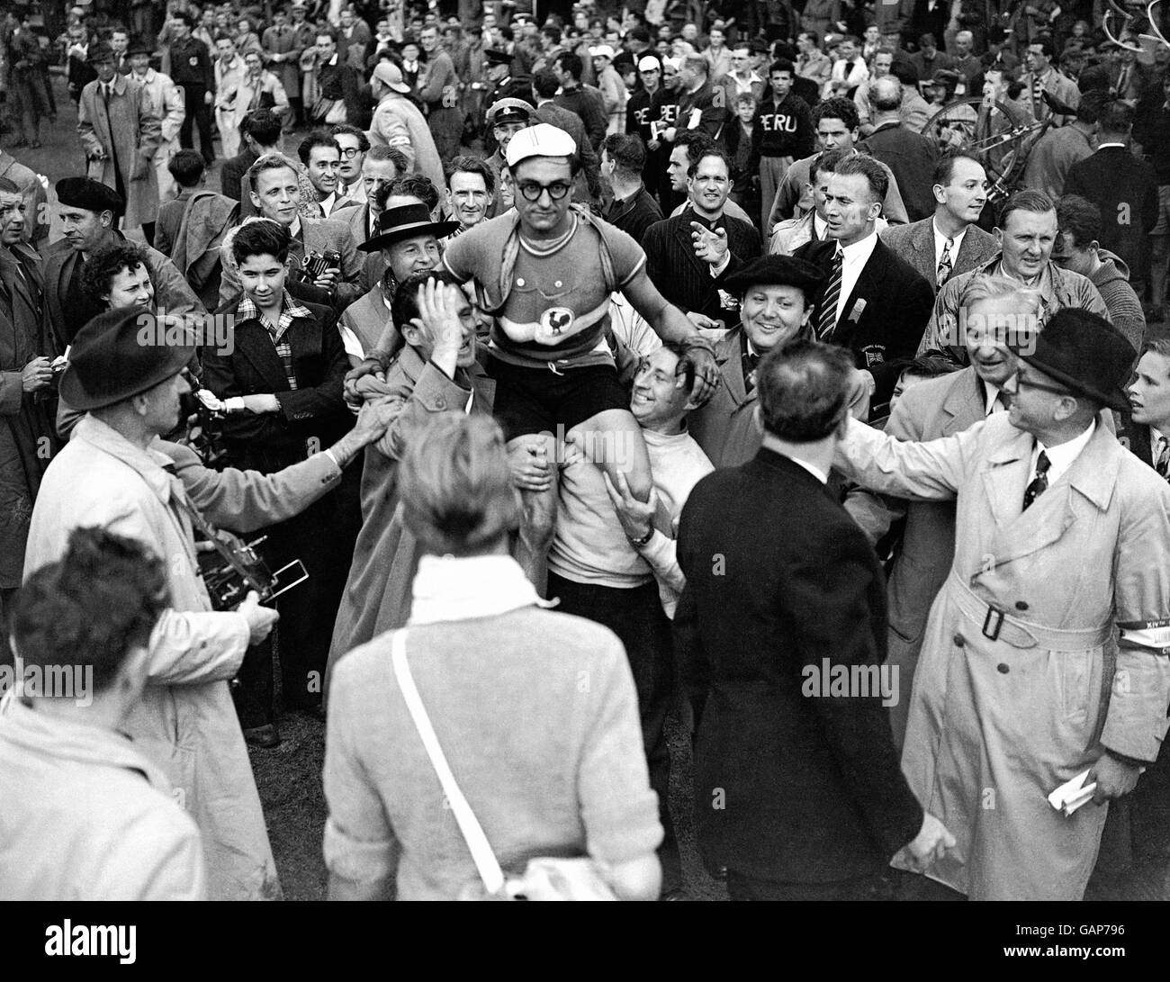 France's Jose Beyaert is chaired by his jubilant comrades after winning the road race Stock Photo