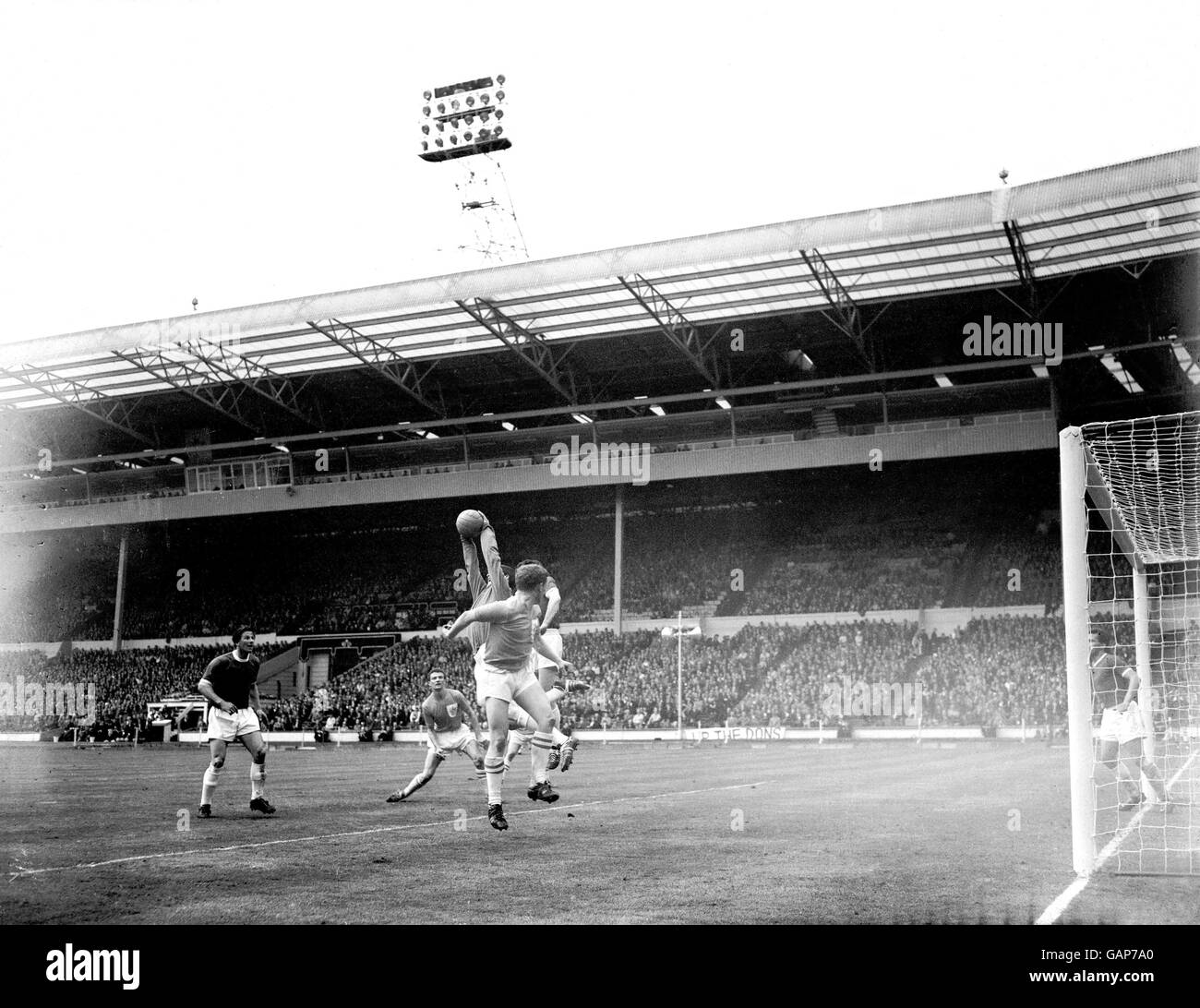 Soccer - FA Amateur Cup - Final - Wimbledon v Sutton United. Wimbledon goalkeeper Mike Kelly (half hidden) leaps to claim the ball Stock Photo