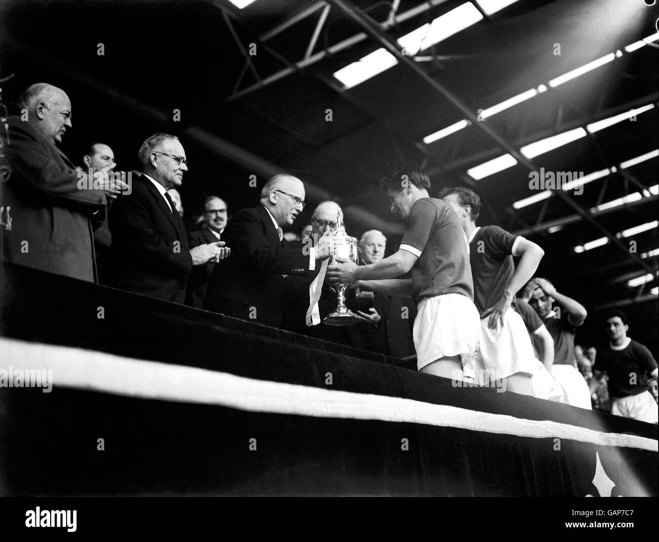 The Lord Mayor of London, Sir Ralph Perring, presents the FA Amateur Cup to Wimbledon captain Roy Law following his team's 4-2 win Stock Photo