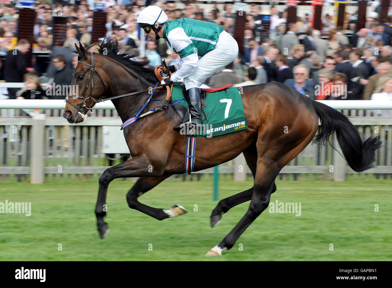 Jockey Michael Hills on American Art goes to post in the Stan James 08000 383384 Handicap at Newmarket Racecourse Stock Photo