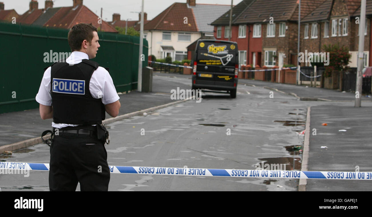 Police officer attends the scene on astley road in huyton hires stock