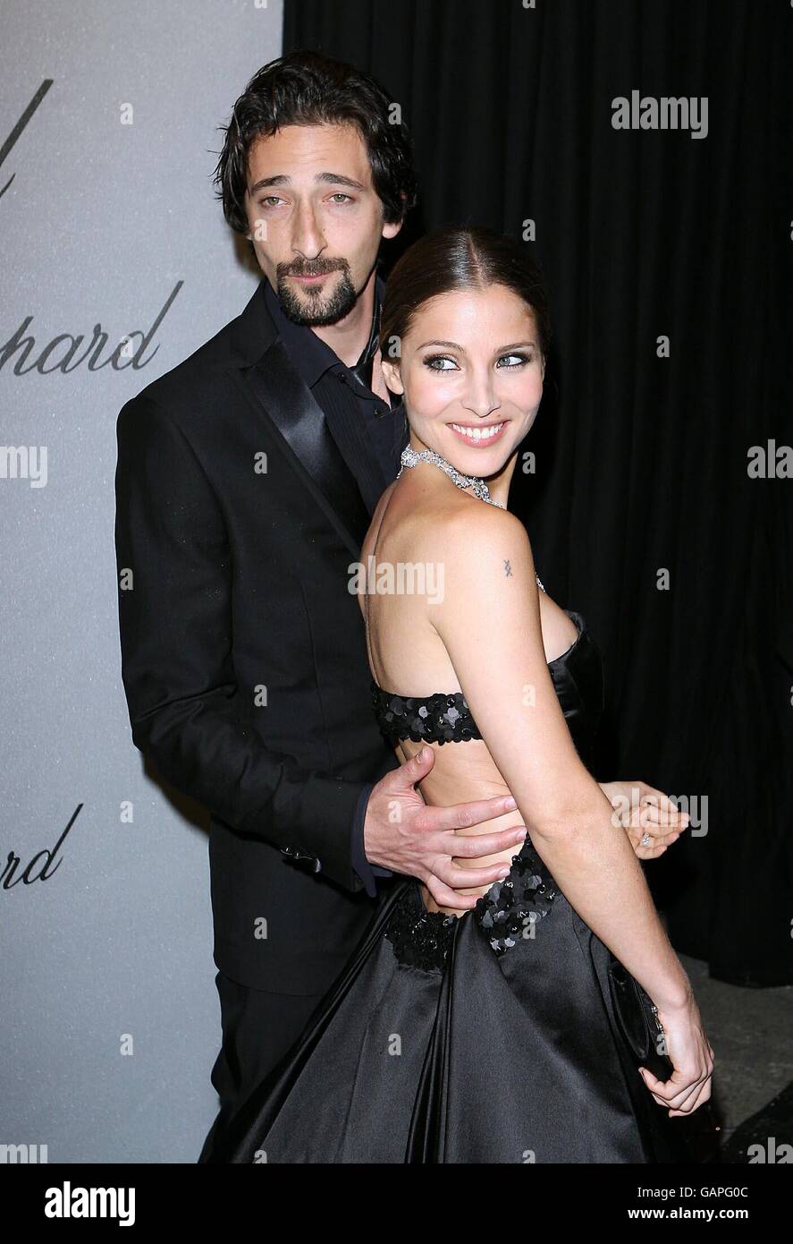 AP OUT Adrien Brody and Elsa Pataky arrive at the Chopard Trophy Caremony at the Carlton Hotel in Cannes, France. Stock Photo