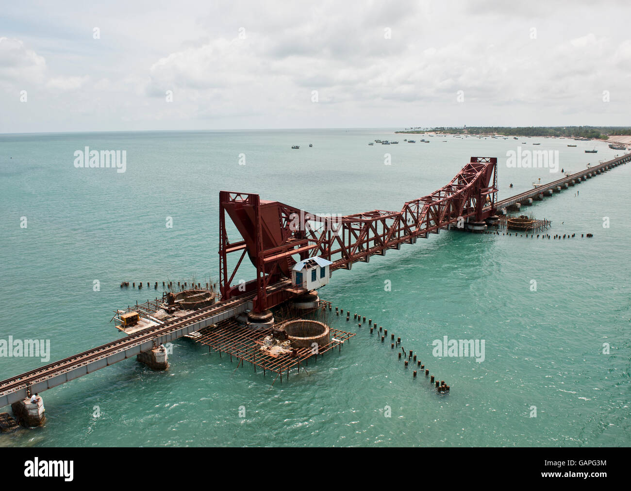 Long and old railway bridge with drawbridge built on sea connecting mainland of south Tamil Nadu India to island of Rameshwaram. Stock Photo