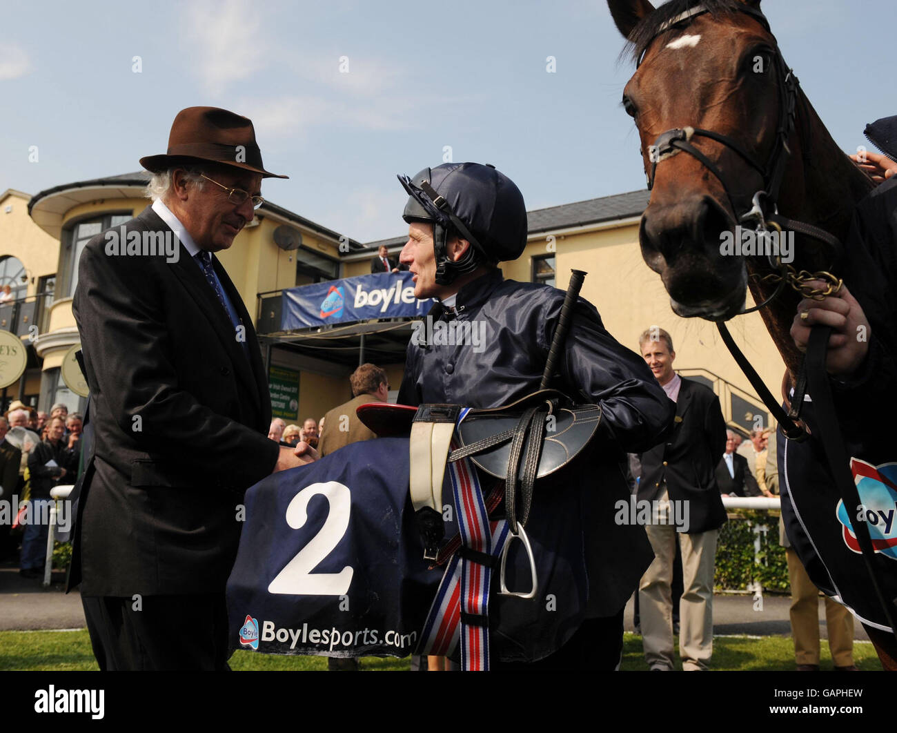Jockey, Johnny Murtagh is congratulated by owner John Magnier after Henry  the navigator had just won the Boylesports Irish 2,000 Guineas at Curragh  Racecourse, Co Kildare, Ireland Stock Photo - Alamy