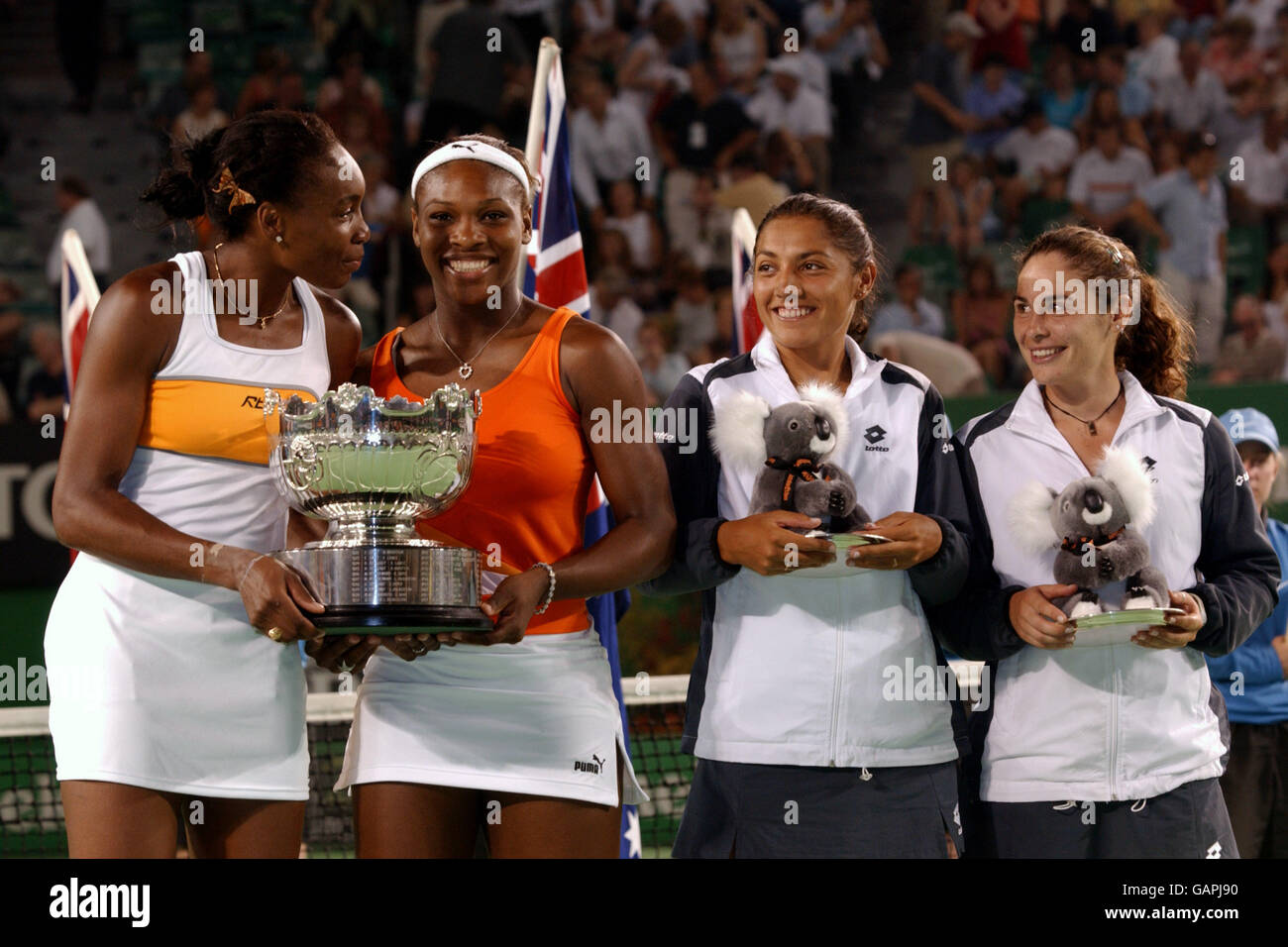 Serena Williams and Venus Williams (USA) hold the trophy after winning the Womens Doubles Final against Virginia Ruano Pascual and Paola Suarez Stock Photo