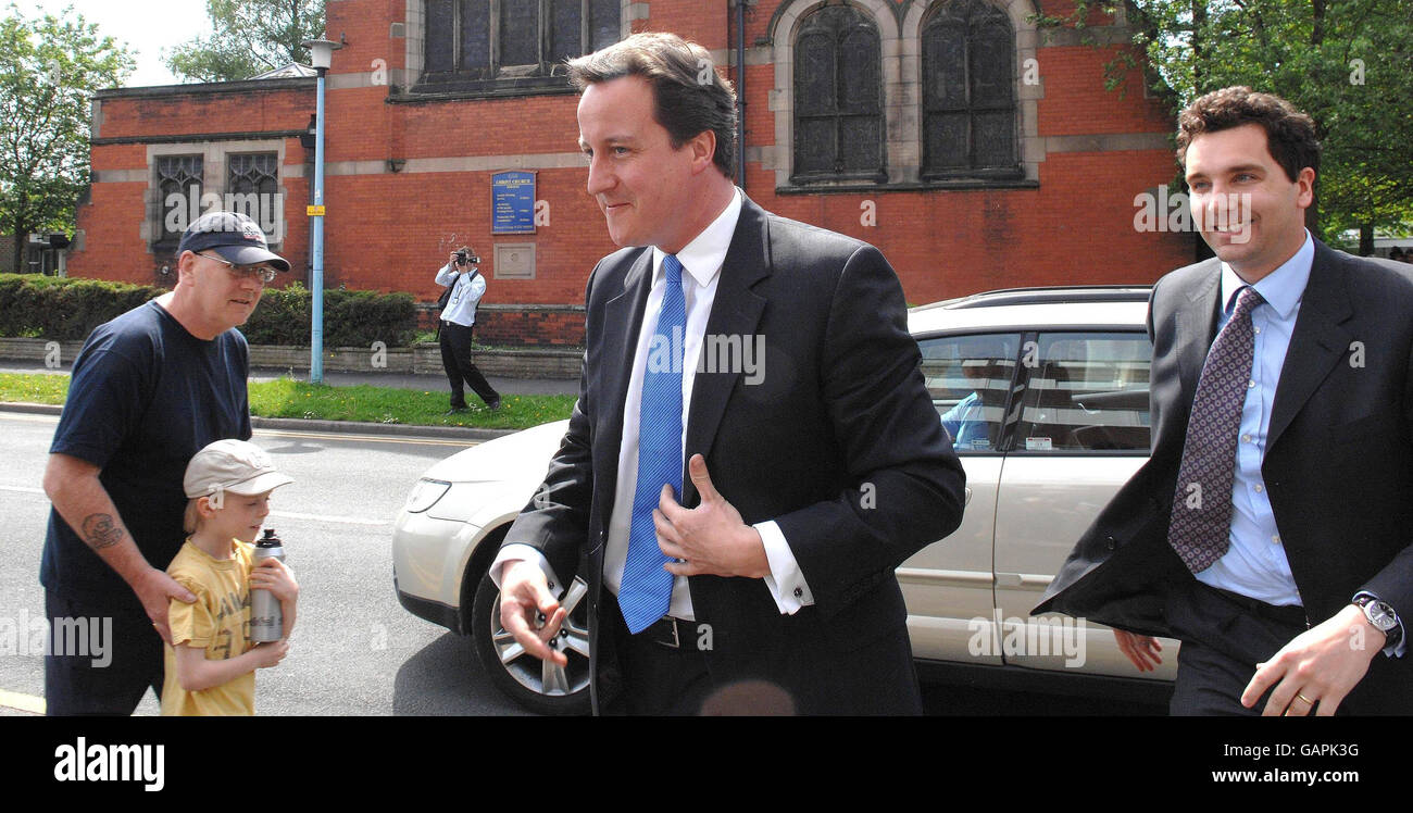 Conservative Leader David Cameron (centre) will talk to police officers during a visit to Crewe & Nantwich to campaign in the by-election with the Conservative candidate Edward Timpson (right). Stock Photo