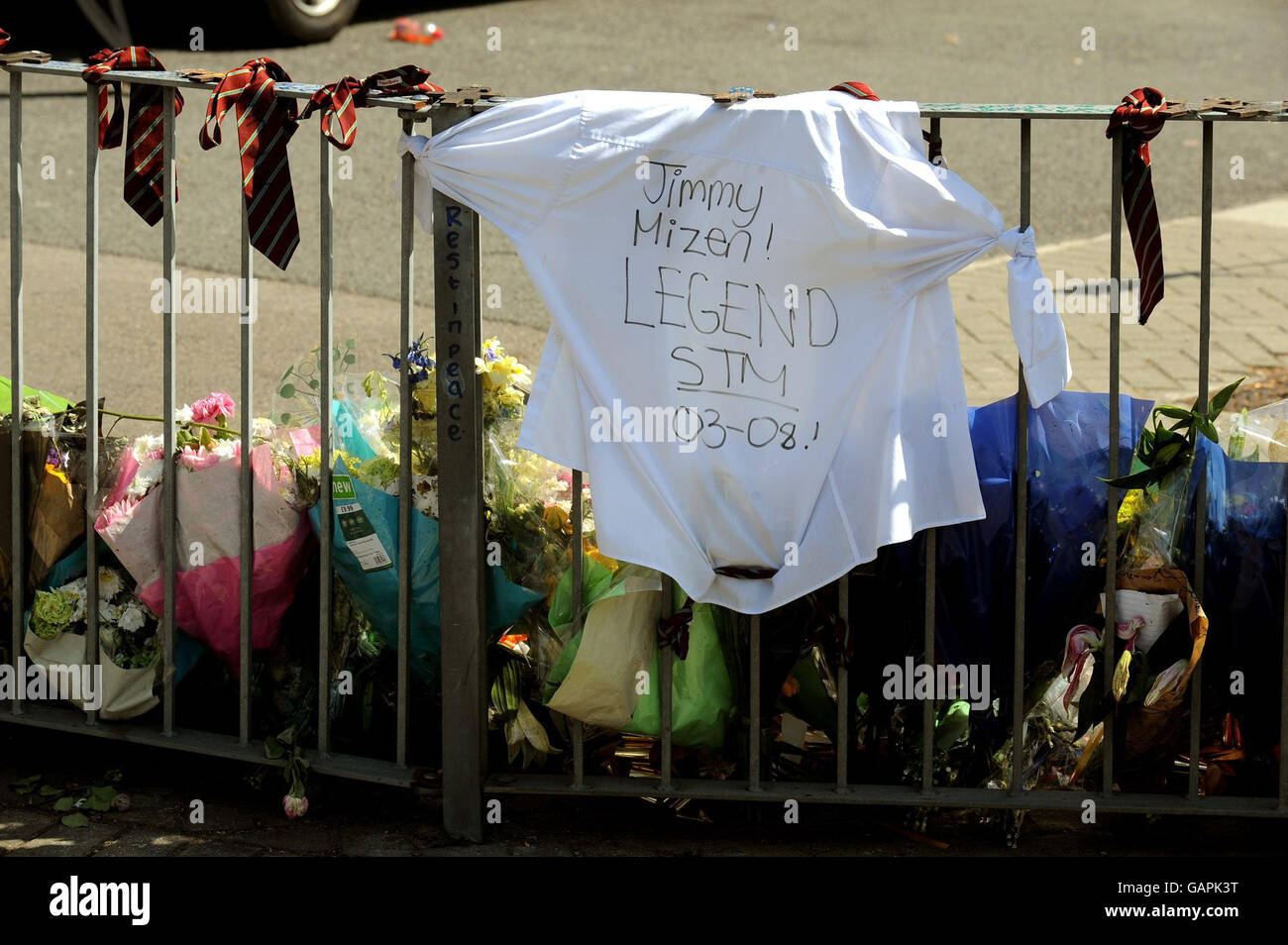 A t-shirt and school ties from St Thomas More School in Eltham south east London, are placed on railings close to where 16 year-old Jimmy Mizen was murdered in an unprovoked attack on Saturday. Stock Photo