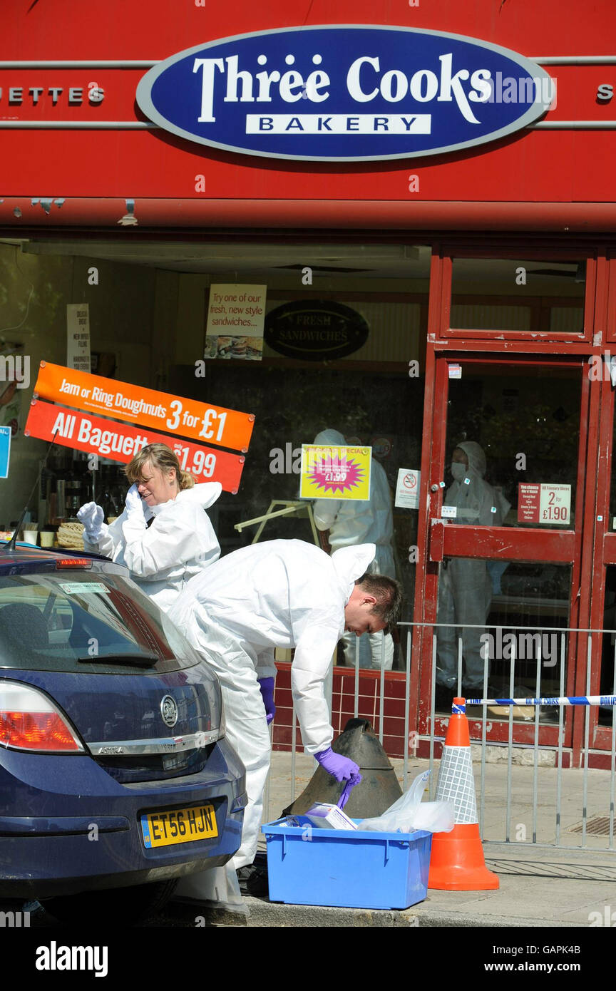 Police forensic officer prepares to enter the three cooks bakery hires