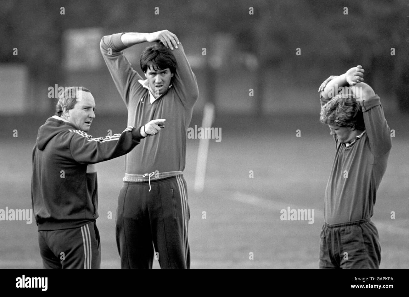 Australia coach Alan Jones (c) makes a point to his players as they stretch before training Stock Photo
