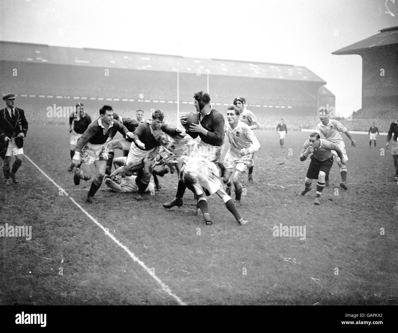 South Africa's Ernst Dinkelman (c) looks to pass the ball as he is tackled Stock Photo