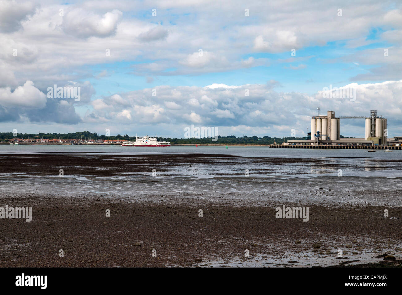 Isle of Wight ferry making its way down Southampton Water from Cowes, Isle of Wight. Grain silos are to the right of the image Stock Photo