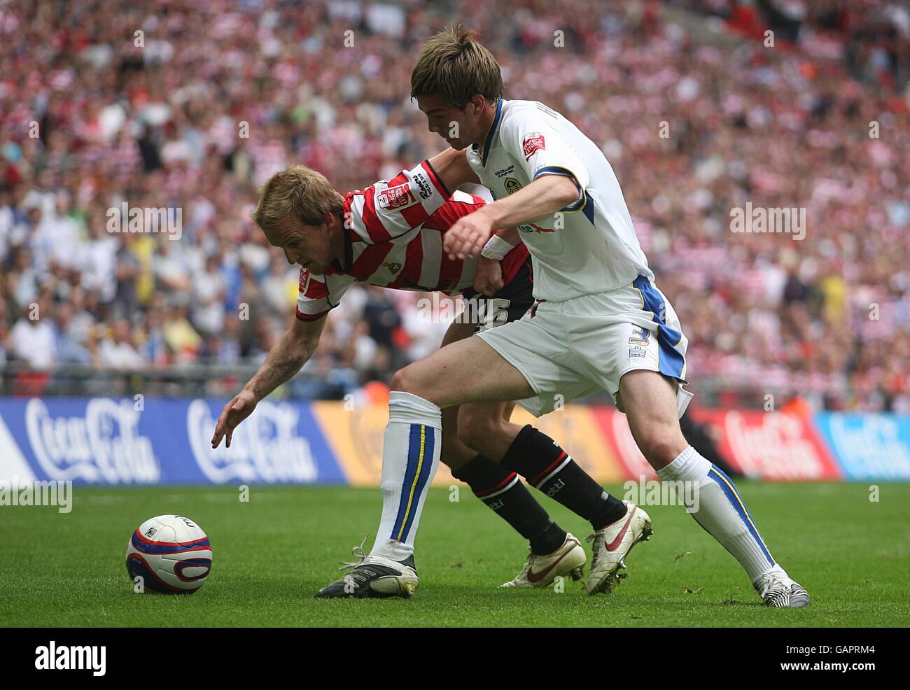 Soccer - Coca-Cola Football League One - Play Off - Final - Doncaster Rovers v Leeds United - Wembley Stadium. Leeds United's Paul Huntington (right) and Doncaster Rovers' James Coppinger battle for the ball. Stock Photo