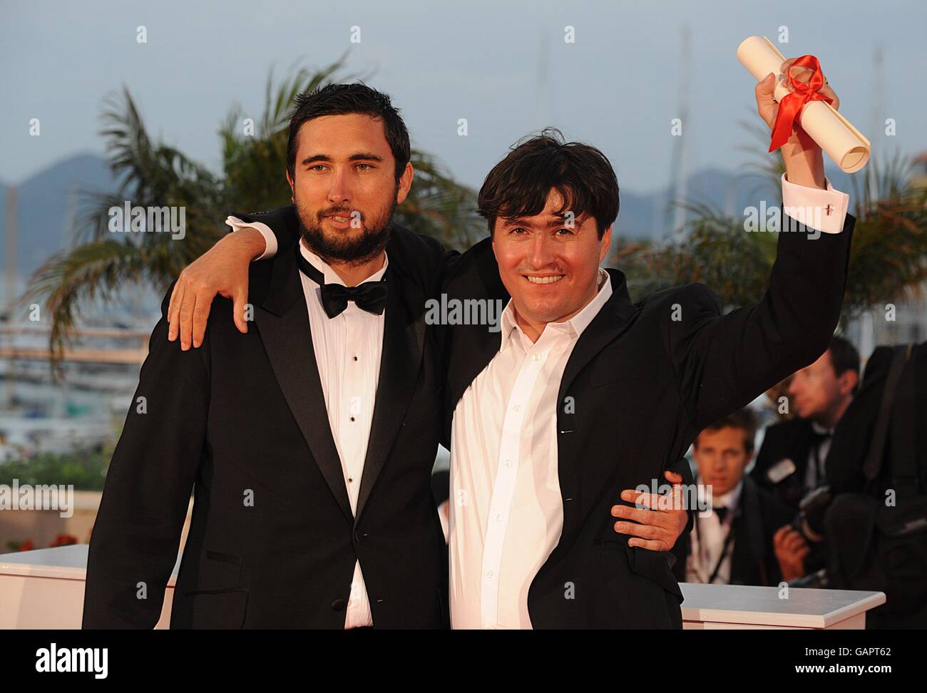 Marian Crisan (right) accepts the Palme d'Or for the Best Short Film for 'Megatron' during the closing ceremony of the 61st Cannes Film Festival in Cannes, France. Stock Photo