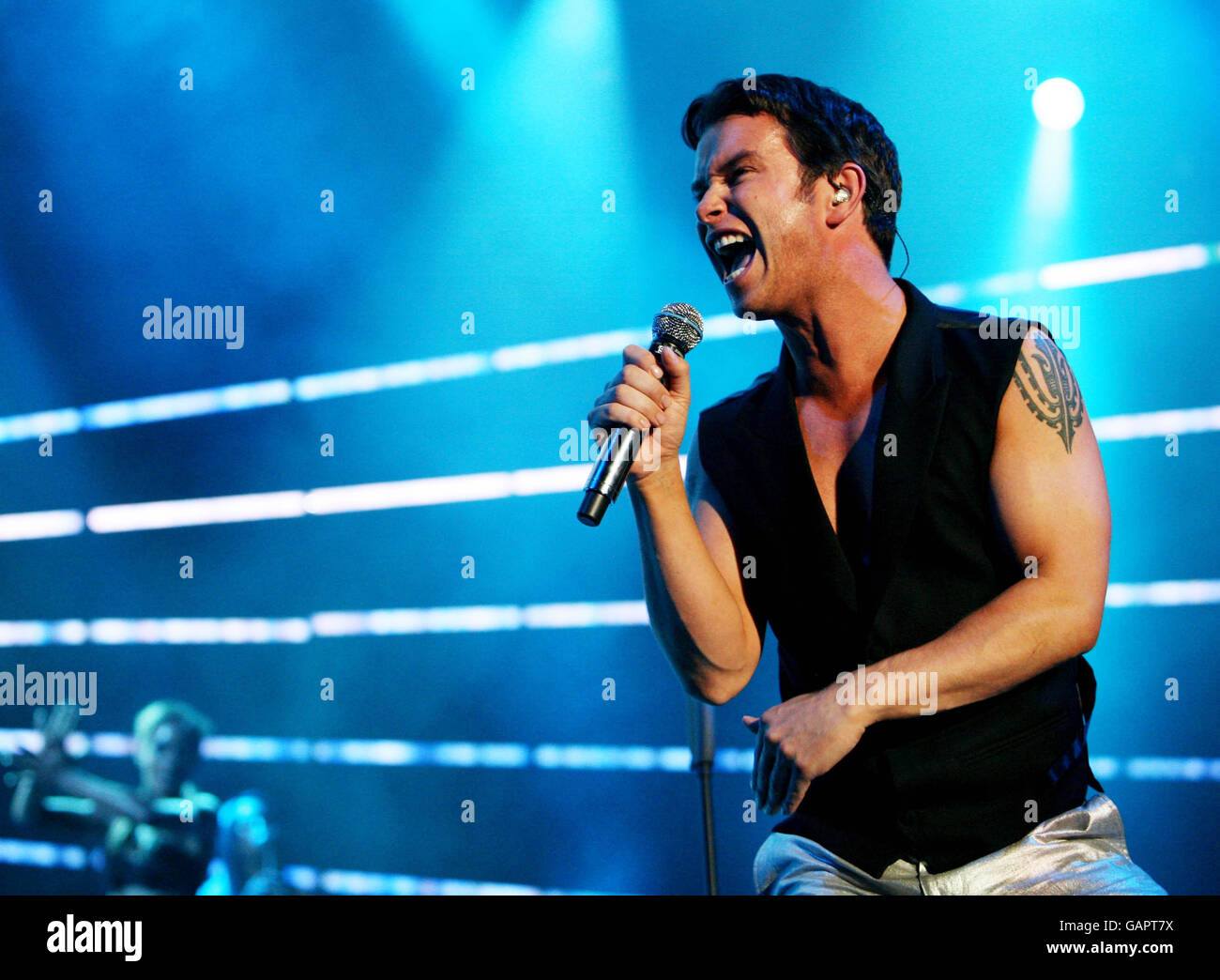 Stephen Gately of Boyzone performs live in concert at the Odyssey Arena Belfast. Stock Photo