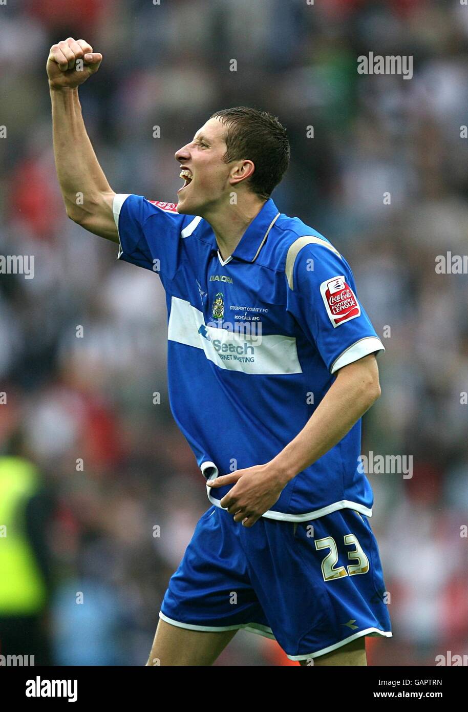 Stockport countys jim mcnulty celebrates his sides promotion to league