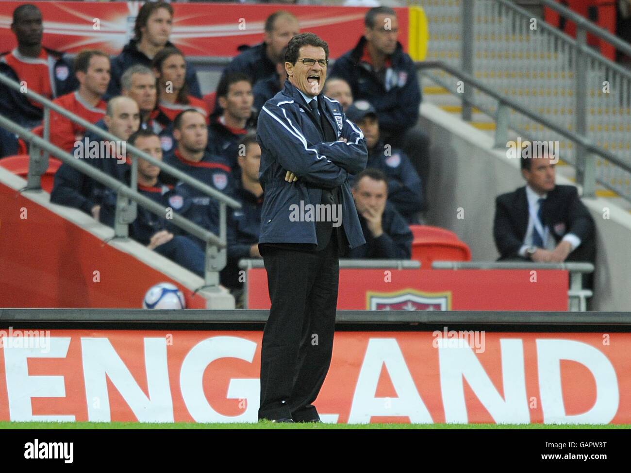 England's manager Fabio Capello shouts from the touchline Stock Photo
